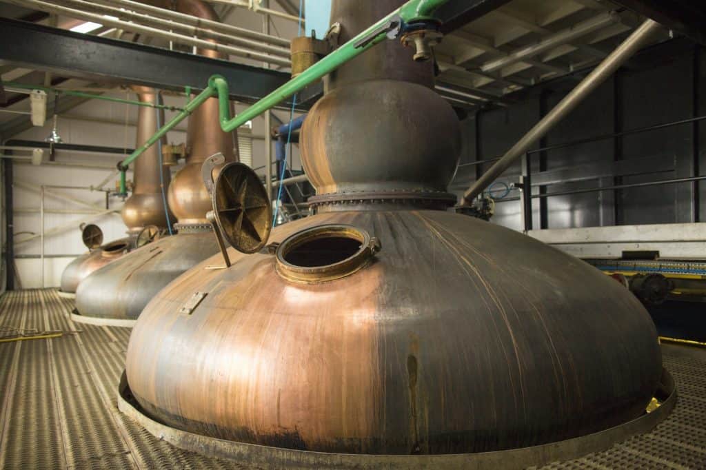 Copper whisky stills in whisky distillery